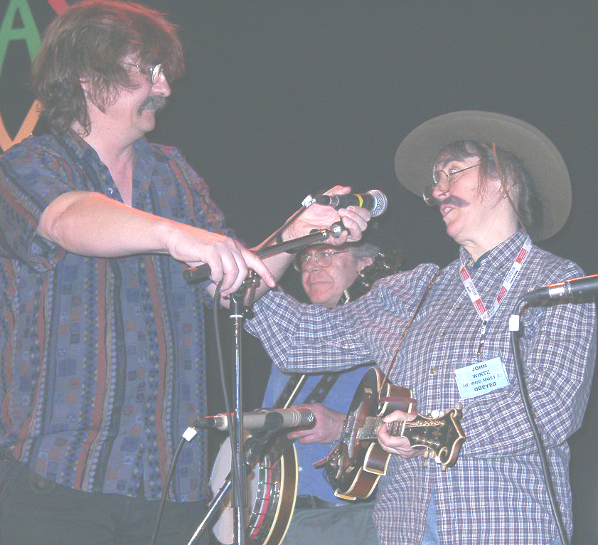 John Wirtz (left), director of Sore Fingers Summer School, adjusting the mike for me as John Wirtz?! But hey, I had a big, one-note solo on fellow tutor Barry Mitterhoff's mandolin that night--Barry and I were high-school classmates! (photo by Nadine White)